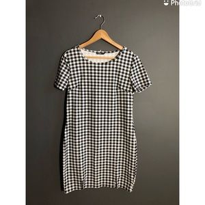checkered dress with a curved hem and body con fit, can be styled up and down.
